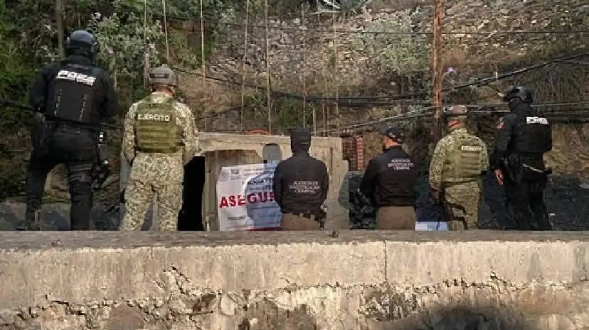 Armed tactical team standing on concrete platform during what appears to be a training or operational exercise